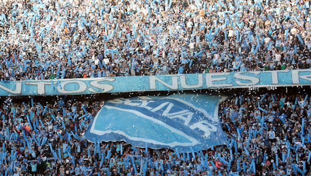 LA PAZ, BOLIVIA - AUGUST 22: Fans of Bolivar cheer on their team during a Copa CONMEBOL Libertadores 2023 quarterfinal first leg match between Bolivar and Internacional at Hernando Siles Stadium on August 22, 2023 in La Paz, Bolivia. (Photo by Gaston Brito Miserocchi/Getty Images)
