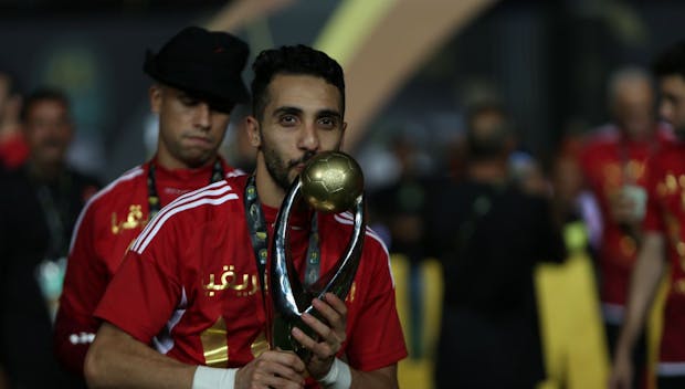 CAIRO, EGYPT - MAY 25: Ahly players celebrate with the winner's trophy after winning the second leg of the CAF Champions League final football match between Egypt's Al-Ahly and Tunis' Esperance Sportive de Tunis at the Cairo International stadium on May 25, 2024 in Cairo, Egypt. (Photo by Ahmad Hasaballah/Getty Images)
