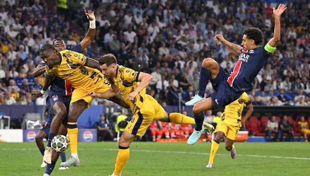 MUNICH, GERMANY - MAY 31: PSG players Willian Pacho (l) and captain Marquinhos (r) challenge Marcus Thuram (2nd l) and Carlos Augusto of FC Internazionale during the UEFA Champions League Final 2025 between Paris Saint-Germain and FC Internazionale Milano at Munich Arena on May 31, 2025 in Munich, Germany. (Photo by Stu Forster/Getty Images)