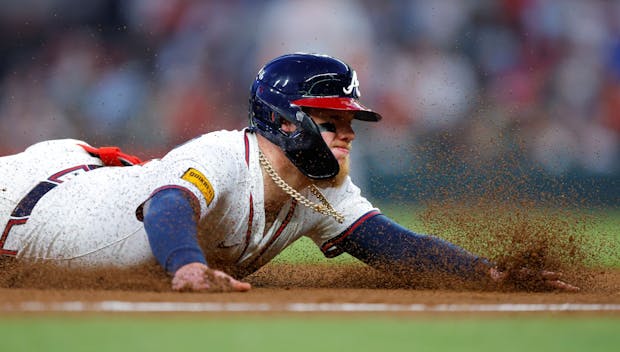 ATLANTA, GEORGIA - MAY 05: Alex Verdugo #8 of the Atlanta Braves slides in to third during the fifth inning against the Cincinnati Reds at Truist Park on May 5, 2025 in Atlanta, Georgia. (Photo by Todd Kirkland/Getty Images)