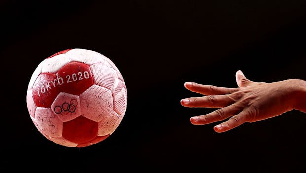 TOKYO, JAPAN - AUGUST 07: The official ball for the Tokyo 2020 Olympic Games handball competition is seen in action during the Men's Bronze Medal handball match between Egypt and Spain on day fifteen of the Tokyo 2020 Olympic Games at Yoyogi National Stadium on August 07, 2021 in Tokyo, Japan. (Photo by Maja Hitij/Getty Images)